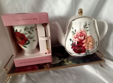 Gift set of a teapot, mug, spoon and coaster.