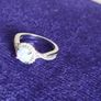 A beautiful 925 silver ring with a white lab opal surrounded by shining cubic zirconia. Image 6