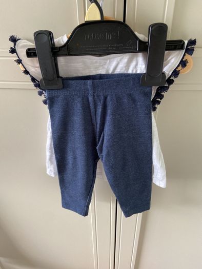 2 piece baby outfit navy leggings white top with neon orange thread detail & navy fringing on capped sleeves