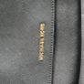 Michael Kors black crossbody bag with adjustable shoulder strap and gold-tone hardware. In great condition, only some colour fading on the logo, as shown in the photos. Image 3