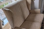 Newly upholstered Parker Knoll high-backed two-seater wingback settee