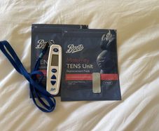 Boots Tens Machine and 2 sets of brand new replacement pads