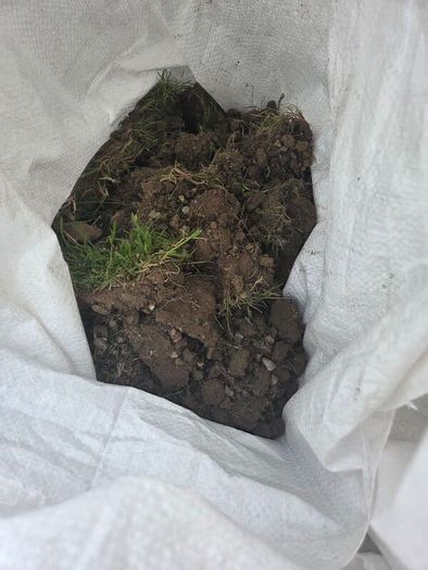 mix of grass sods, soil and stone