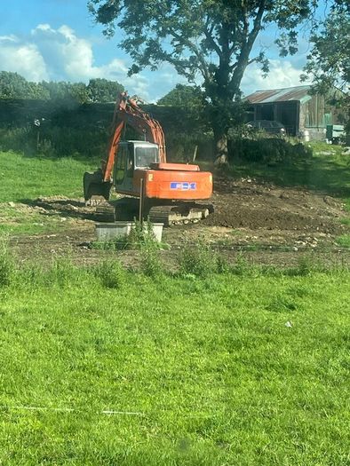 Man and digger for hire