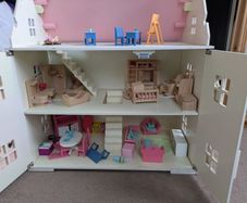 wooden doll house with furniture
