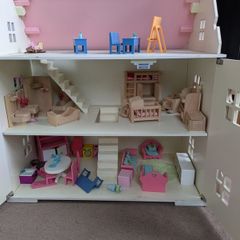 wooden doll house with furniture