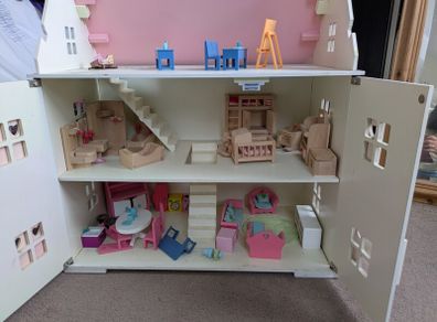 wooden doll house with furniture
