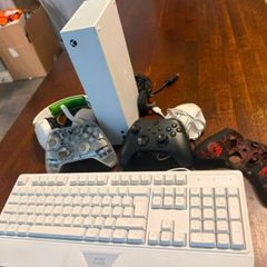 xbox series s, 2controllers and keyboard and mouse includes a cover for controller and the box also includes HDMI cable and Power Cable and headset
