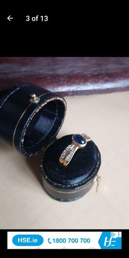 18 ct gold ring with Sapphire stone and 16 brilliant cut diamonds