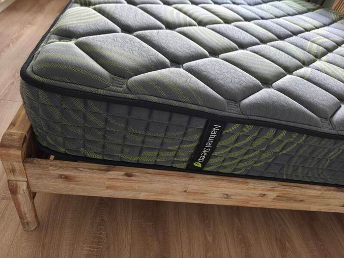 Super King mattress with wooden bed