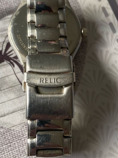 Relic face changing watch with broken watchstrap