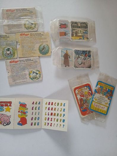 Scrace lot of 1980s retro cereal freebies . Kelloggs Rice crispies , sugar puffs stickers games and cards .