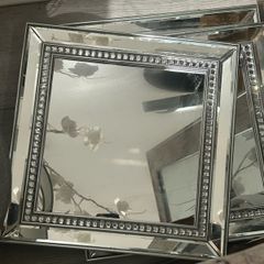 3 square, silver-framed accent mirrors with a beaded crystal inlay border.
