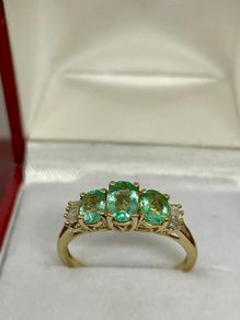 Silver ring with emeralds