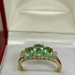 Silver ring with emeralds
