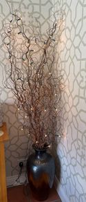 Ceramic Floor Urn Vase styled with contorted willow and fairy lights