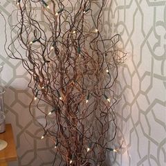 Ceramic Floor Urn Vase styled with contorted willow and fairy lights