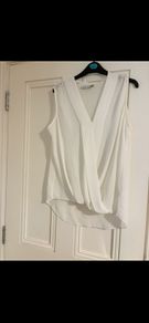 Paraphrase dressy sleeveless top, states size 14 but more like 16