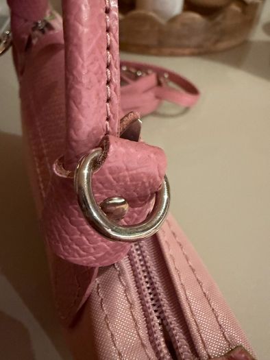 pink Longchamp Le Pliage mini top-handle bag with a detachable shoulder strap