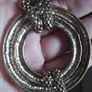 Vintage necklace with a pendant in the form of a ring and links in the form of a snake in gold tone. Image 2