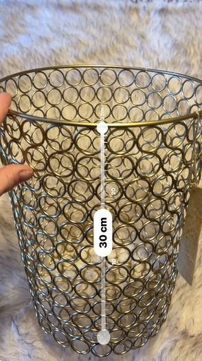 Two gold metal bins