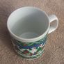 A vintage Christmas mug by Kilncraft (early 1980s) - children at play with snow-sledge design Image 4