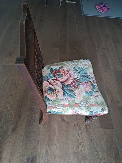 Vintage wooden chair with floral upholstery