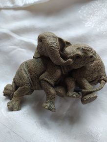 Collectible elephant. & Rhino sculpture from Martha Carey