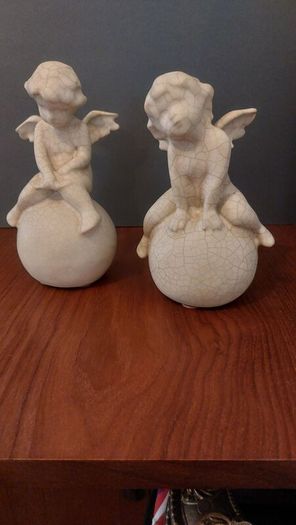 Lovely Vintage Pair of Ceramic Baby Winged Angels Sitting on Globes with a Very Tactile Cream Coloured Crackle Glaze