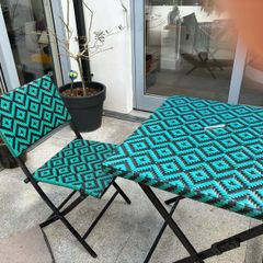 bistro table and two chairs