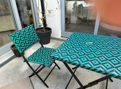 bistro table and two chairs