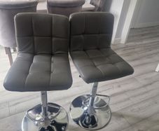 2 grey leather look swivel bar stools