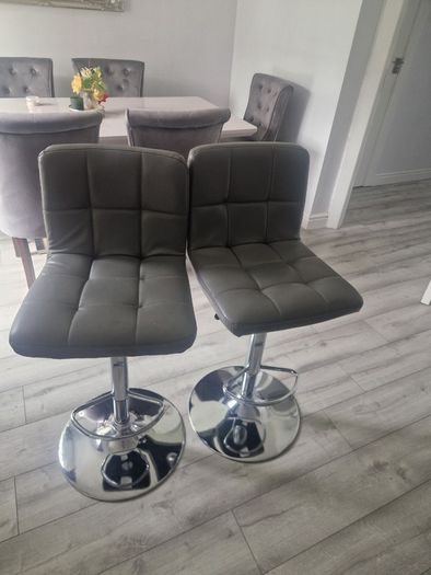 2 grey leather look swivel bar stools