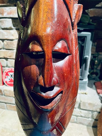 Two carved tribal masks