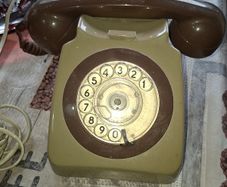 Beautiful Old Rotary Dial Phone features a beige body and a matching handset Postage Available