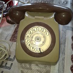 Beautiful Old Rotary Dial Phone features a beige body and a matching handset Postage Available