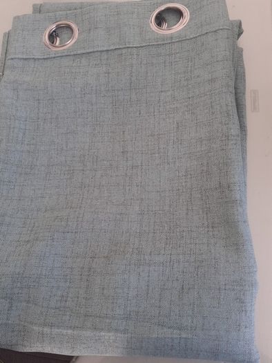 As new green linen curtains .Size 56"width x 82"length .A lot brighter than the pics .Just hung for a few days but dont go in the room .Unlined but heavy .Ringtop 12 euro .