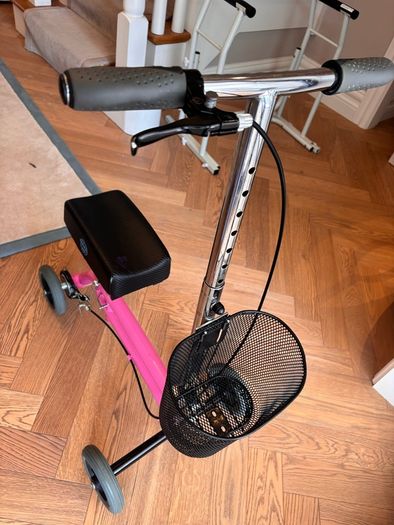 Kneerover Junior mobility knee scooter in pink. Well-used, but still working well!