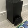 xbox series X with original controller and Jurassic World evolution two and halo infinity Image 3