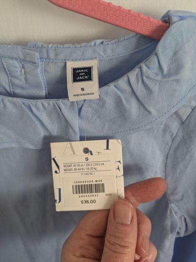 Blue top with tags