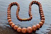 Gold sun stone necklace