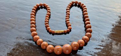 Gold sun stone necklace