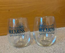 A Pair of clear stemless Muckross Irish Gin glasses