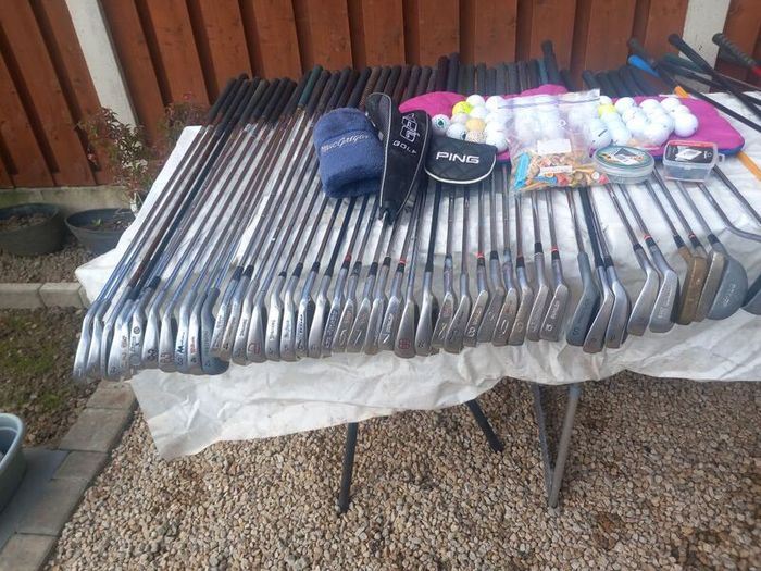 A selection of golf clubs and bags. Golf balls