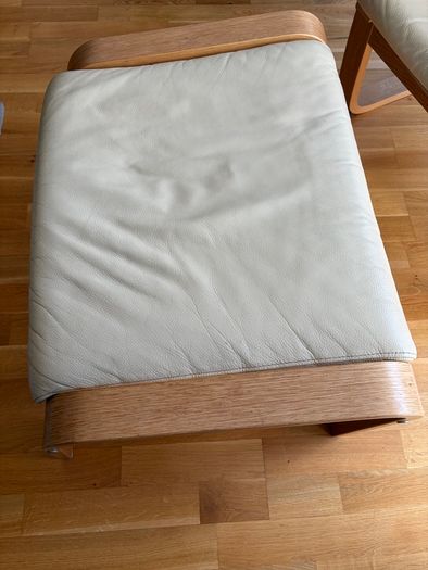 Cream leather armchair and matching footstool