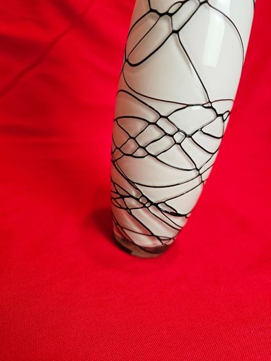 A decorative glass vase made of blown art glass, resembling a bottle in Murano style. Ornament