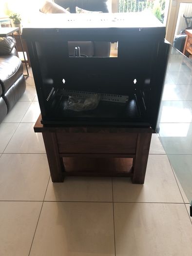Cams wall mounted 9U cabinet with a variety of cables and connections