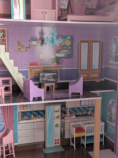 Large wooden dolls house with furniture