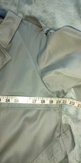 Vintage Nuage ladies trenchcoat Approximately late 90s early 00s Size 10 on label The colour is a pale bluey grey with brown buttons It's got an inner lining that can be removed