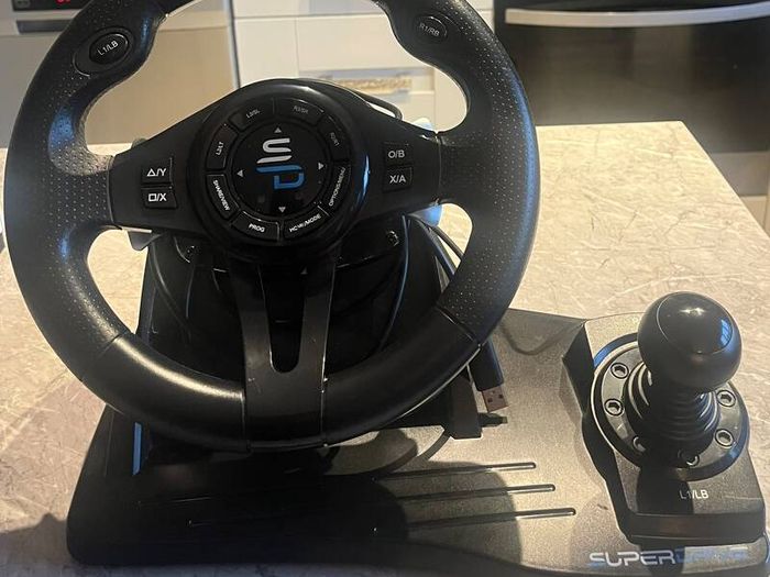 X-Box 1s with steering wheel and peddles